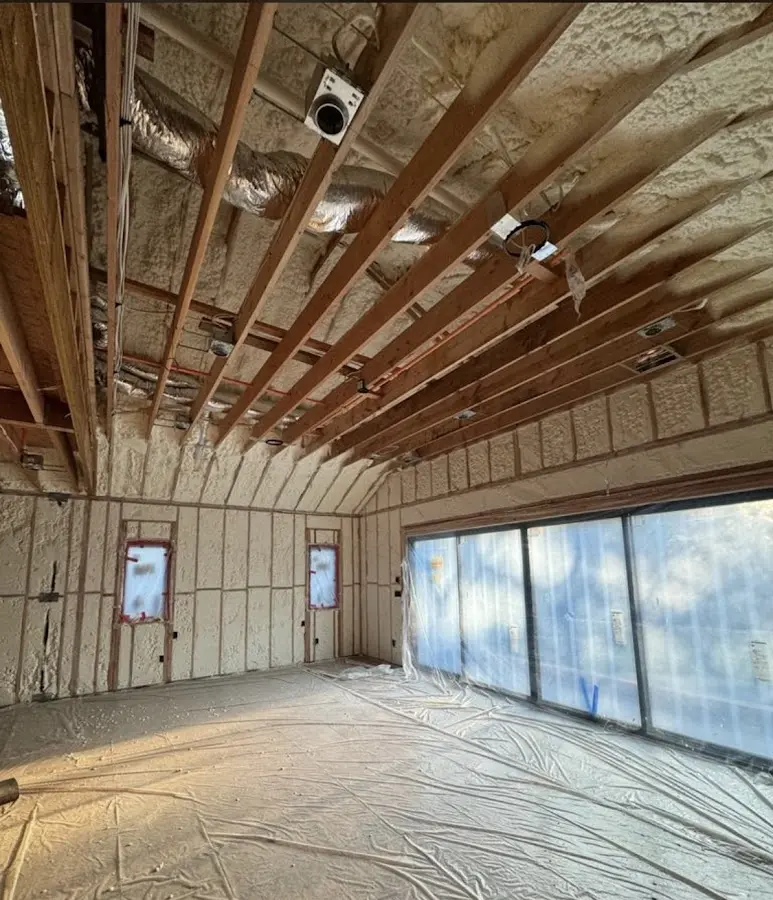 Interior walls and ceiling insulated with spray foam during new construction in Muscatine